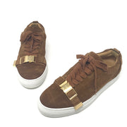 Buscemi buckled calf suede low-top Sneaker in tan. Consists of a 1 inch sole with a round toe and golden buckle. Lace up front with an embossed logo on the side and the tongue. Rubber outsole. Faint signs of wear on the soles and light fading on the suede.  Size: EU 43  Made in Italy. 