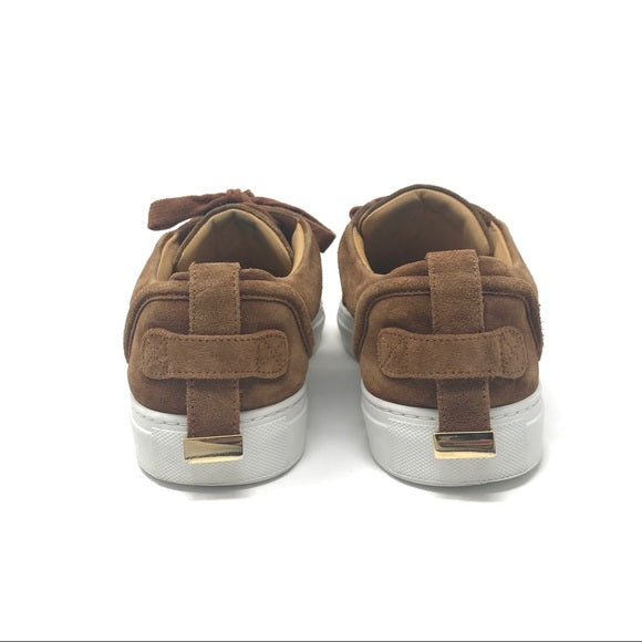 Buscemi buckled calf suede low-top Sneaker in tan. Consists of a 1 inch sole with a round toe and golden buckle. Lace up front with an embossed logo on the side and the tongue. Rubber outsole. Faint signs of wear on the soles and light fading on the suede.  Size: EU 43  Made in Italy. 